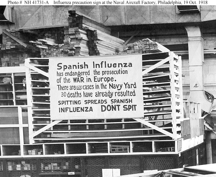 Black and white photo of a sign warning about Spanish Influenza